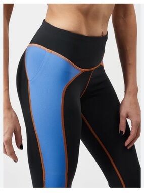 Janji Groundwork Black Tights with Blue Panels and Orange Stitching